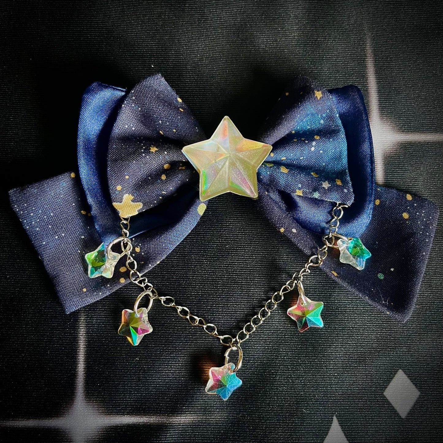 100% Cotton and Satin Mini star cosmic print hair bow with chain and resin sparkling stars. Handmade and for sale