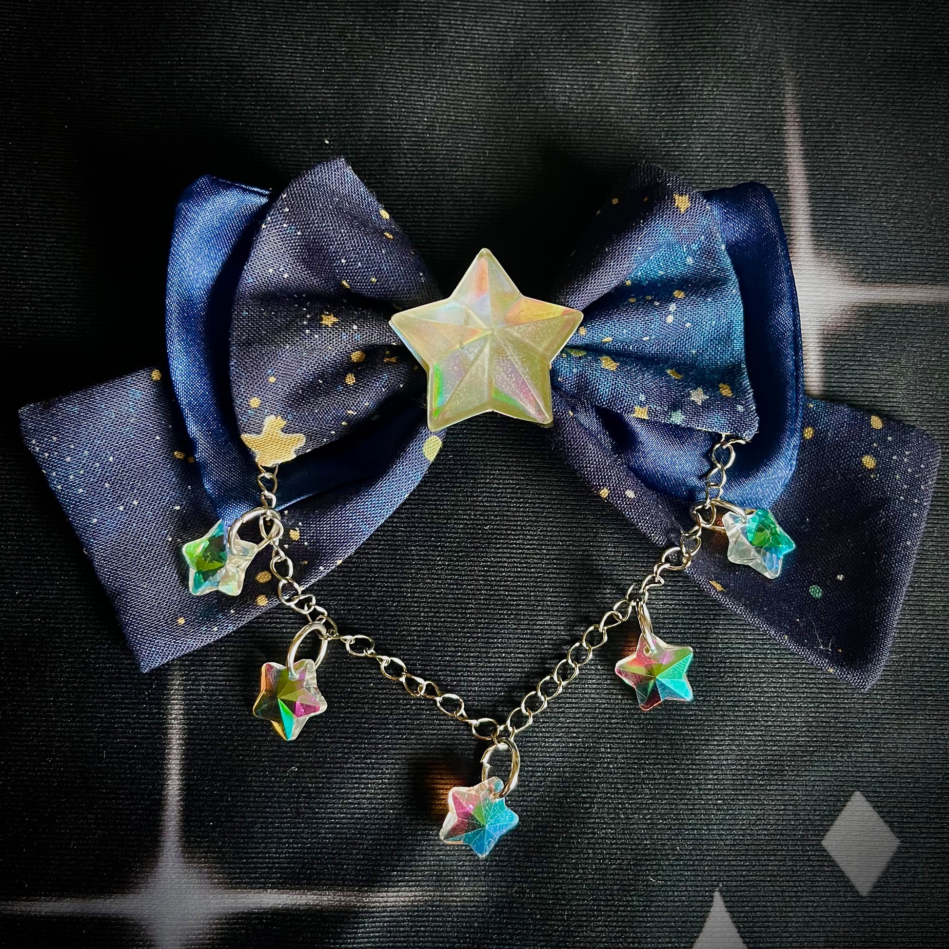 100% Cotton and Satin Mini star cosmic print hair bow with chain and resin sparkling stars. Handmade and for sale